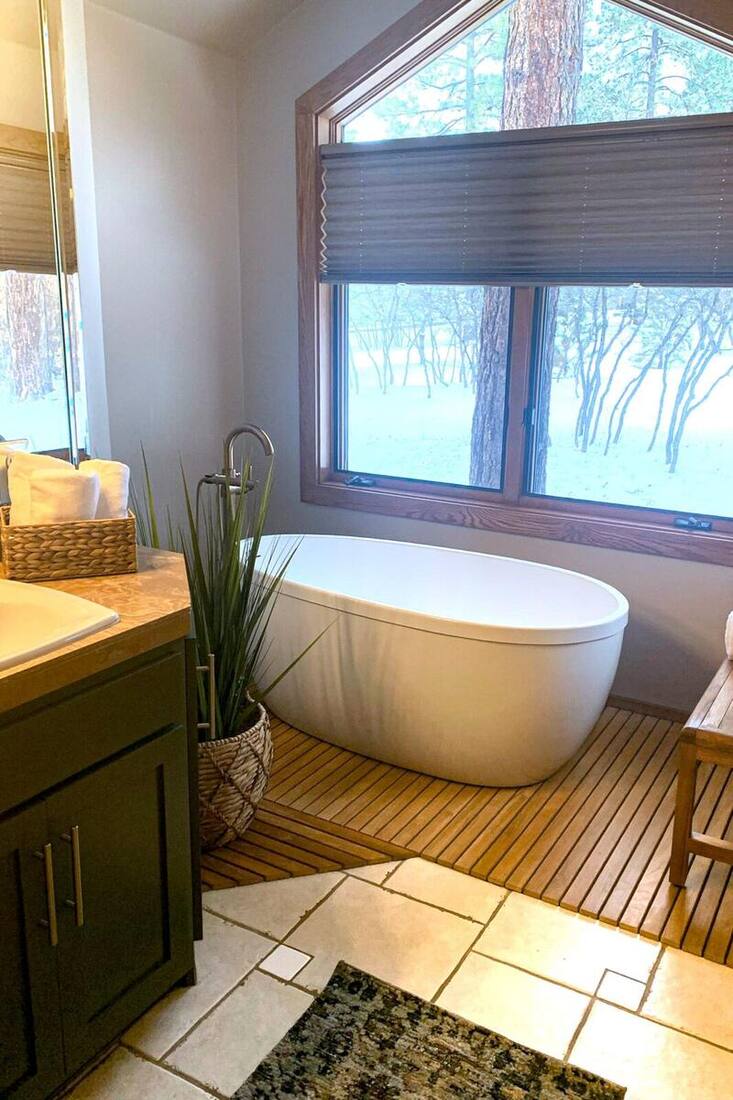 Blue Ridge spa bathroom design with freestanding tub and teak flooring